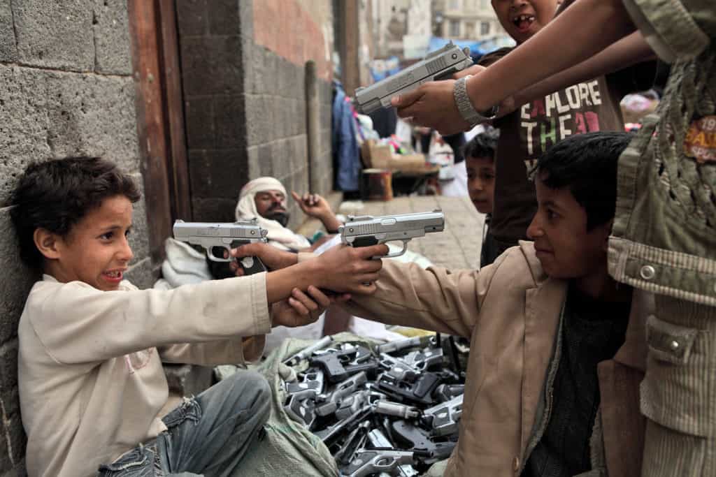 Kids in Sanaa playing with toy guns