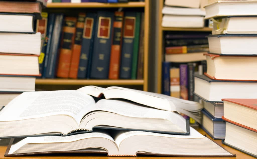 Stacks of books in a library or office for studying law