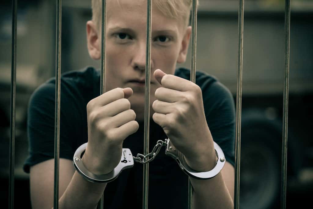 juvenile delinquent behind bars