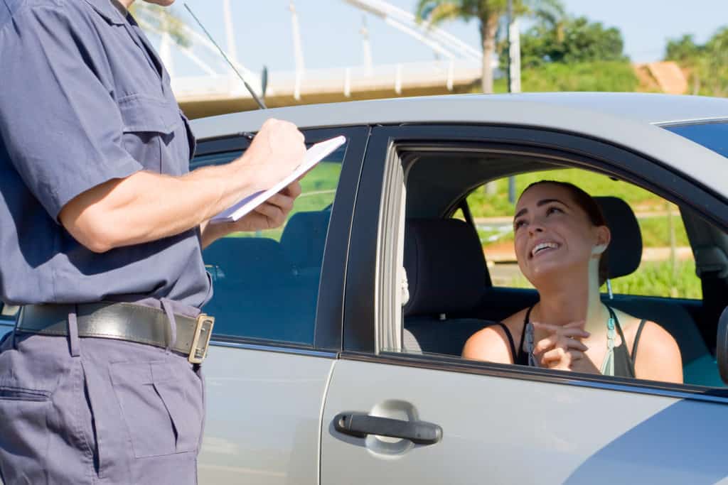 female driver begging traffic police not to write a ticket