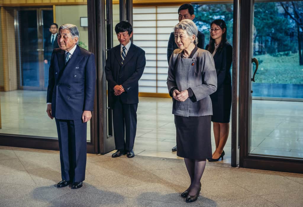 Tokyo Japan - February 26 2015: Emperor of Japan Akihito and Empress Michiko stands in front of entrance to Imperial Residence called Gosho