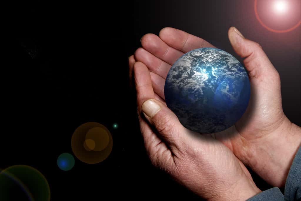 A pictorial of Earth in a pair of hands