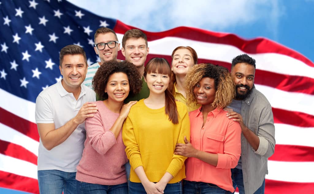 diversity, immigration, friendship and people concept - international group of happy smiling men and women over american flag background