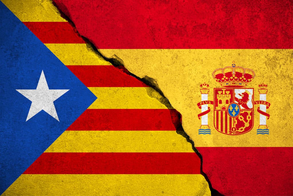 spain flag on broken brick wall and half catalan flag vote referendum for catalonia independence exit national crisis separatism risk concept