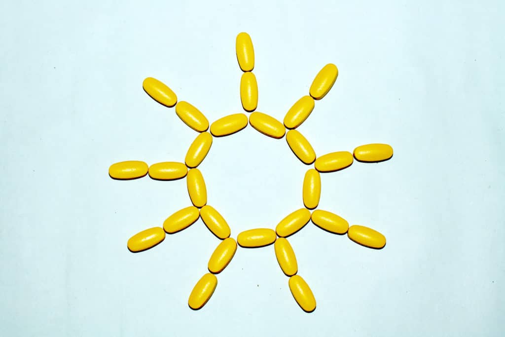 Tablets and capsules are lined in the form of the sun.