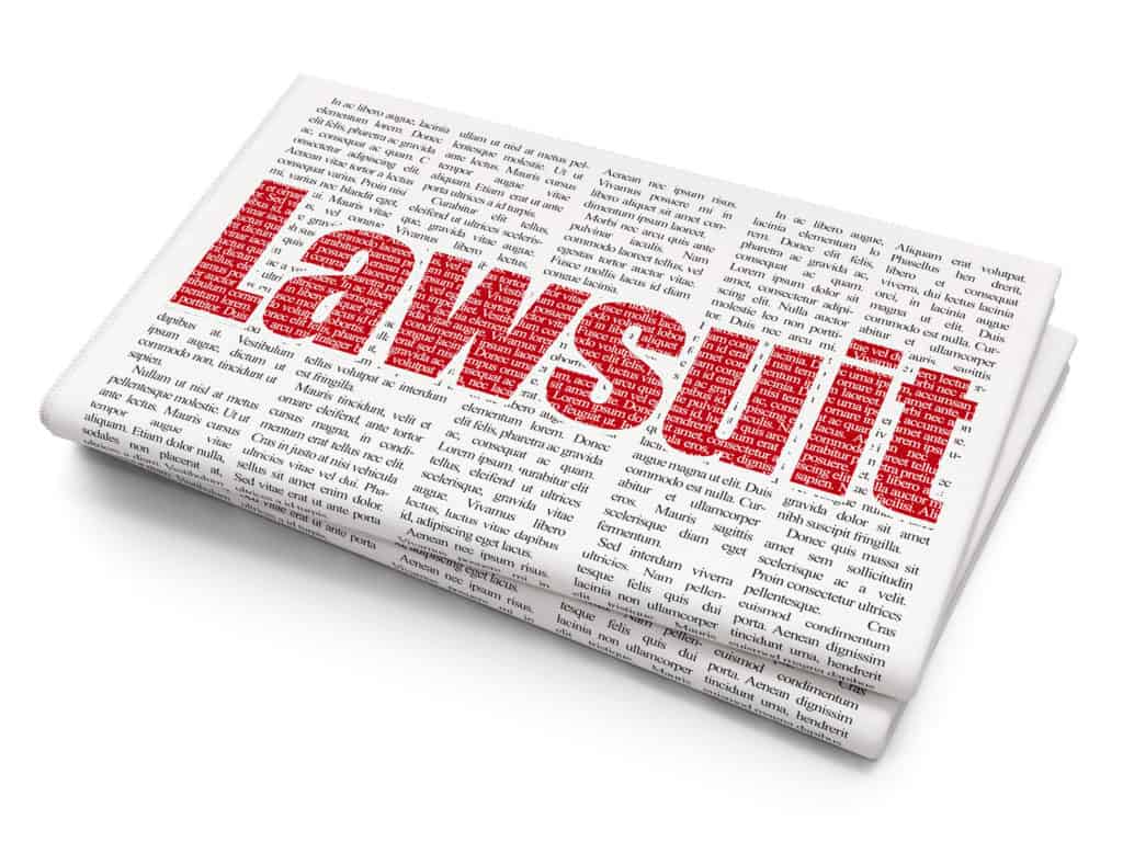 Law concept: Pixelated red text Lawsuit on Newspaper background, 3D rendering