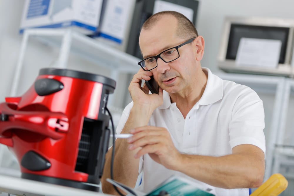 man testing a defective product