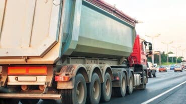 3 Reasons You Are Legally Required to Have a Tarp System on a Dump Truck