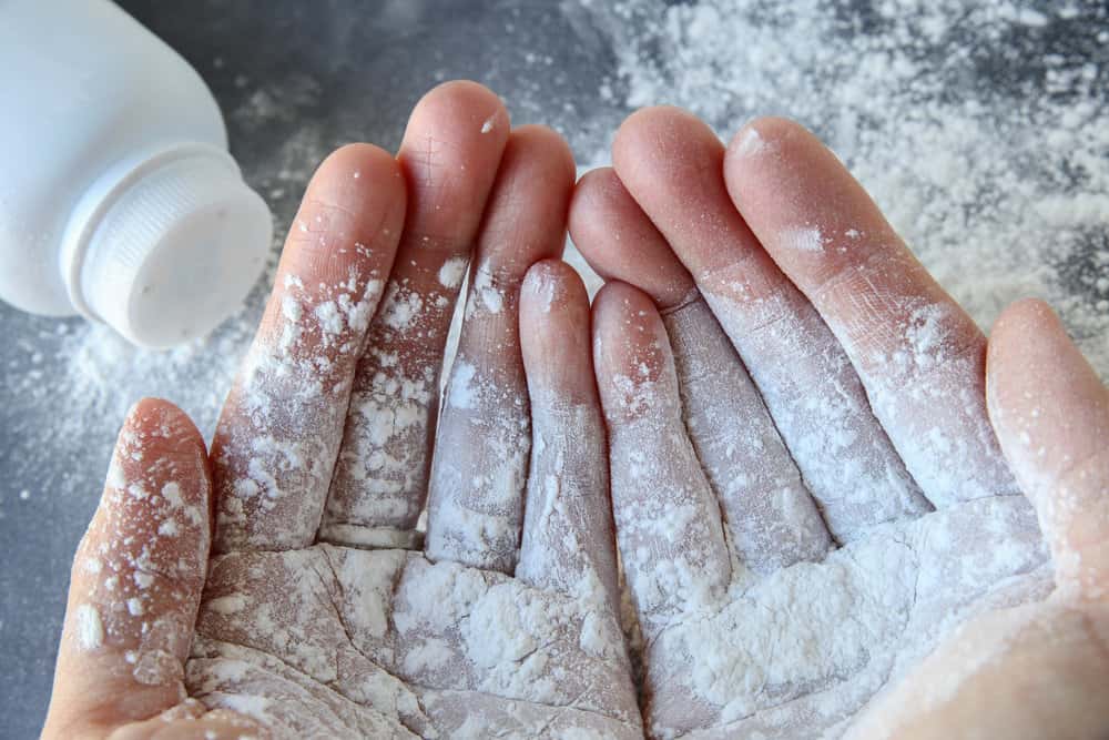 pic of talc-based baby powder in hands