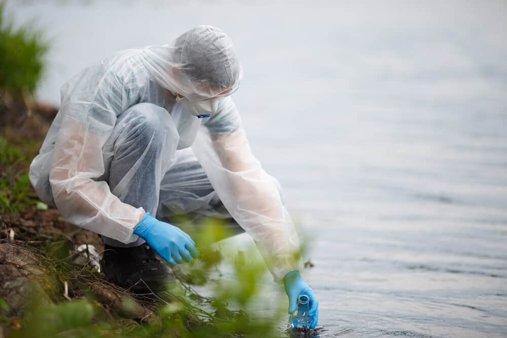 picture of person getting contaminated water sample