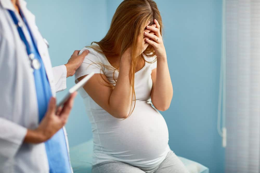 photo of worried pregnant woman