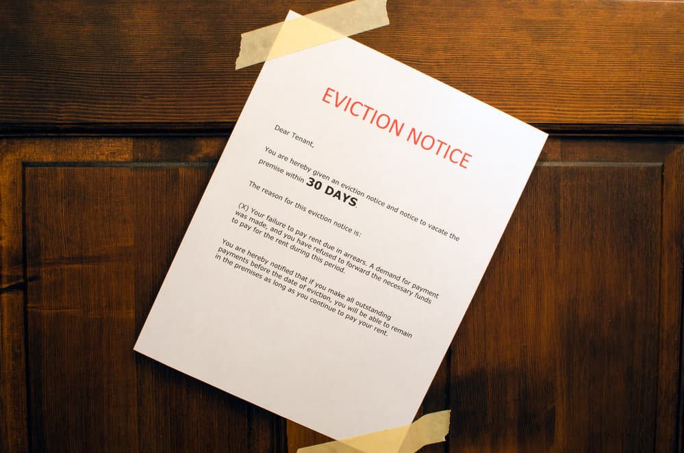 An eviction notice taped to a door.