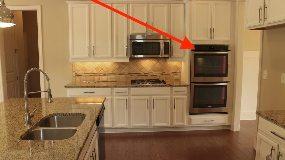 red arrow pointing to jennair control panel on double oven