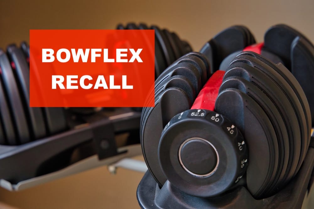 bowflex recall stamp over set of bowflex dumbbells