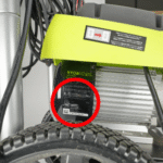 ryobi-pressure-washer-model-number-location Close-up of Ryobi pressure washer motor cover showing model number label plate location circled in red