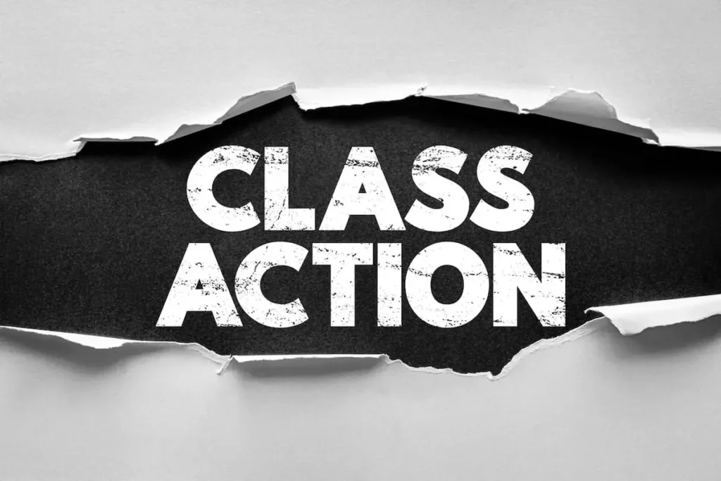 Class Action in white letters showing through torn gray paper